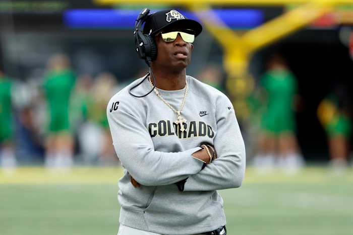Colorado Buffaloes head coach Deion Sanders watches the reply board during the first half against the Oregon Ducks at Autzen Stadium